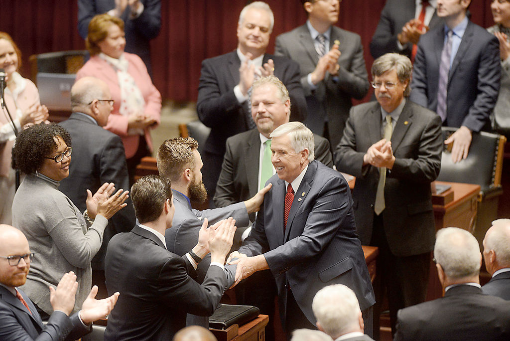 Gov. Mike Parson greets members of the Missouri General Assembly before the State of the State